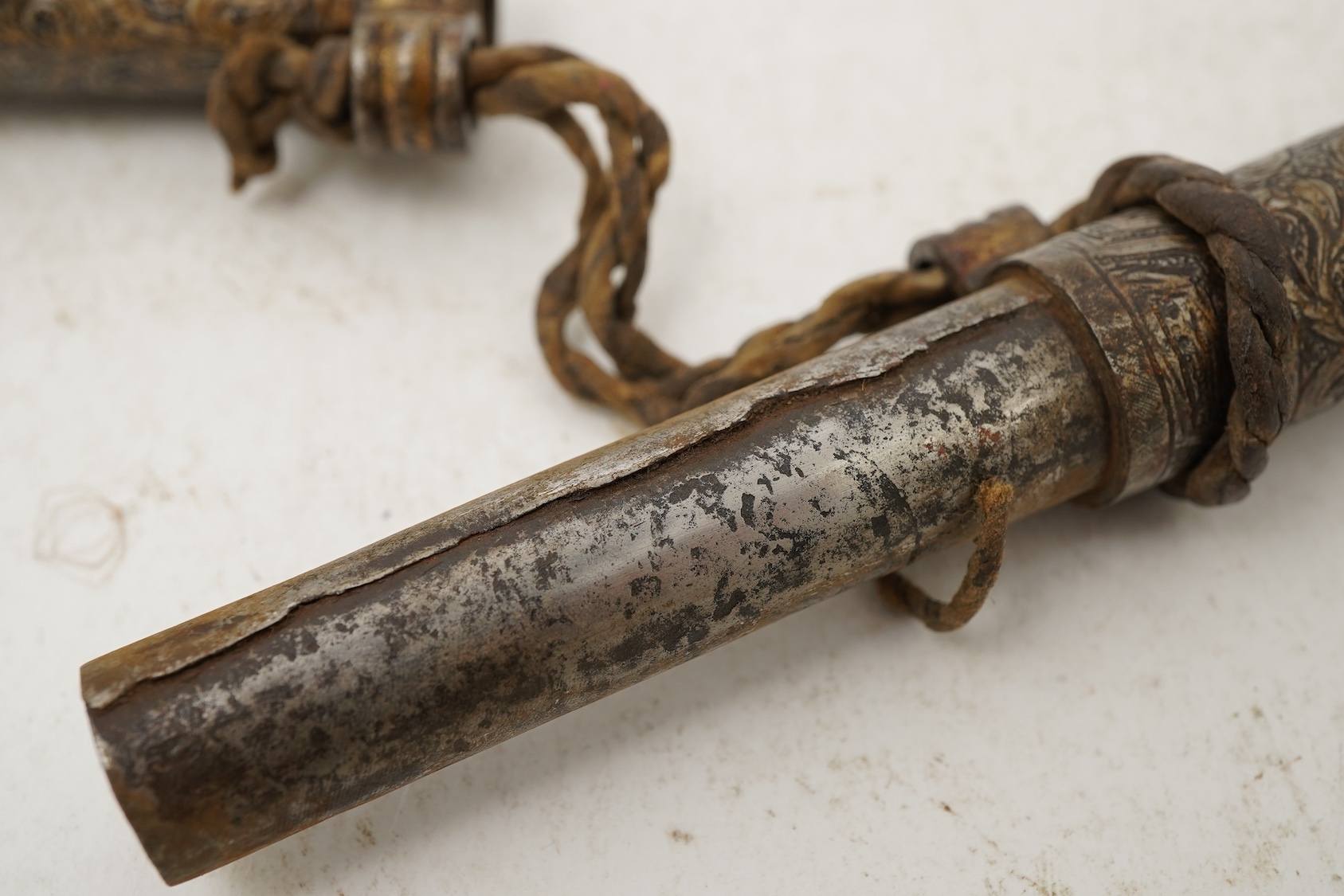 A Tibetan damascened iron scroll holder, 17th century